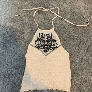 Cream crop top with velvet black floral pattern!